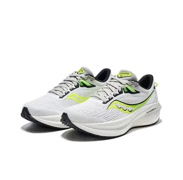 Saucony Triumph 21 running shoes front view, white knit upper with neon green accents