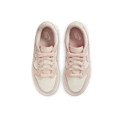 Light pink lace-up low-top sneakers with white midsoles; top view of both shoes.