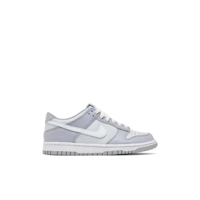 Nike SB Dunk Low sneaker side view, white leather with gray swoosh and lace trim