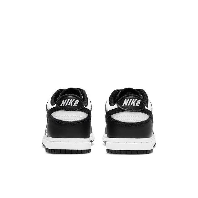 Low-top skate sneaker heels, black uppers with white NIKE heel tab and lace loops