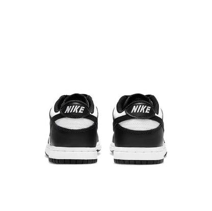 Low-top skate sneaker heels, black uppers with white NIKE heel tab and lace loops