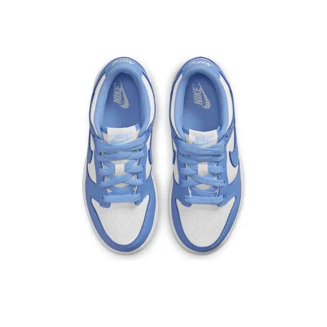 Low-top sneakers showing blue tongue label and lace-up front in white and blue