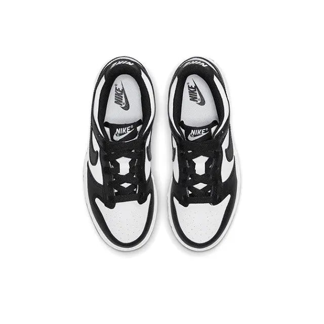 Low-top skate sneakers top view, black laces with white panel and Swoosh branding