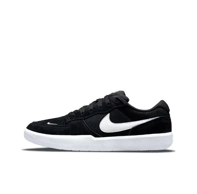 Black low-top skate shoes with white Swoosh and white midsole