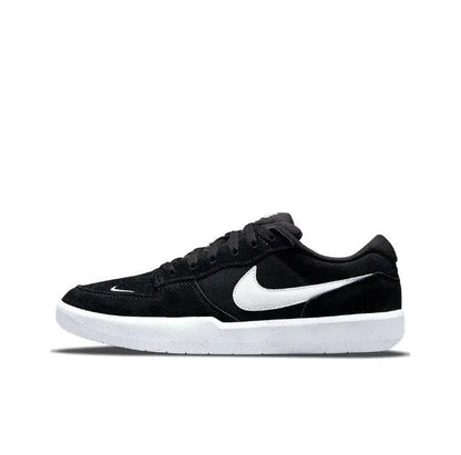 Black low-top skate shoes with white Swoosh and white midsole