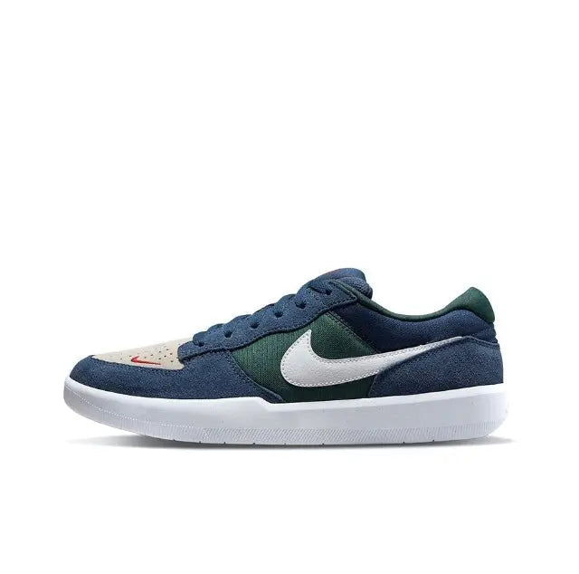 Blue and green low-top skate shoes with white swoosh and lace-up front