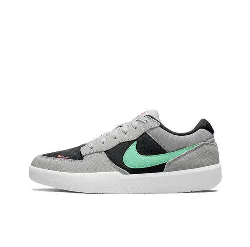 Nike SB Force 58 low-top skate shoe in light grey with black and green accents