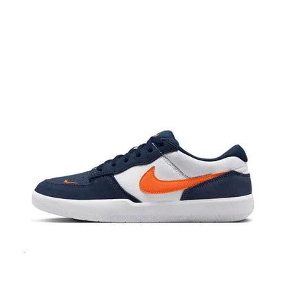 Navy low-top sneakers with orange swoosh, white side panel, and white rubber sole