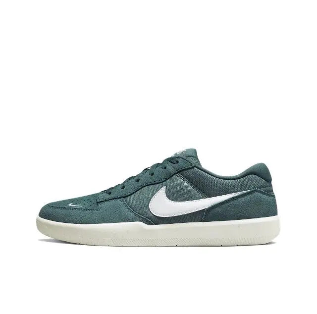 Green low-top sneakers with white Nike swoosh, lace-up front, and white sole