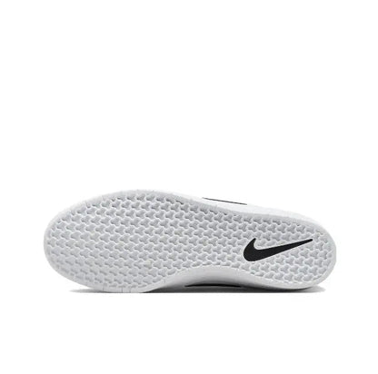 White outsole of a low-top skate sneaker with black Nike Swoosh logo