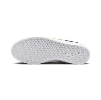 White outsole tread with Nike swoosh mark on navy-and-white low-top sneakers