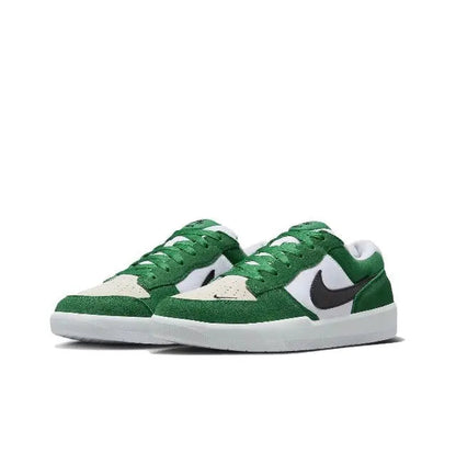 Green and white low-top sneakers, front view with black Swoosh and lace-up