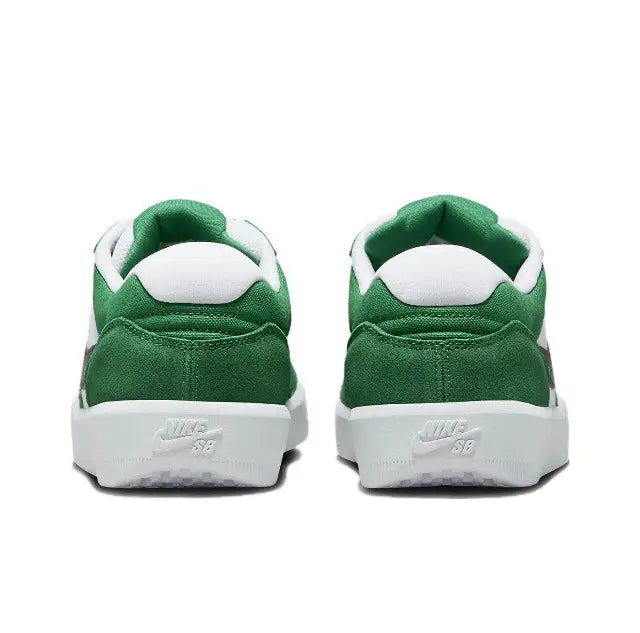 Green low-top sneakers with white heel tab and Nike SB logo on back