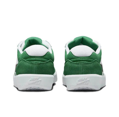 Green low-top sneakers with white heel tab and Nike SB logo on back