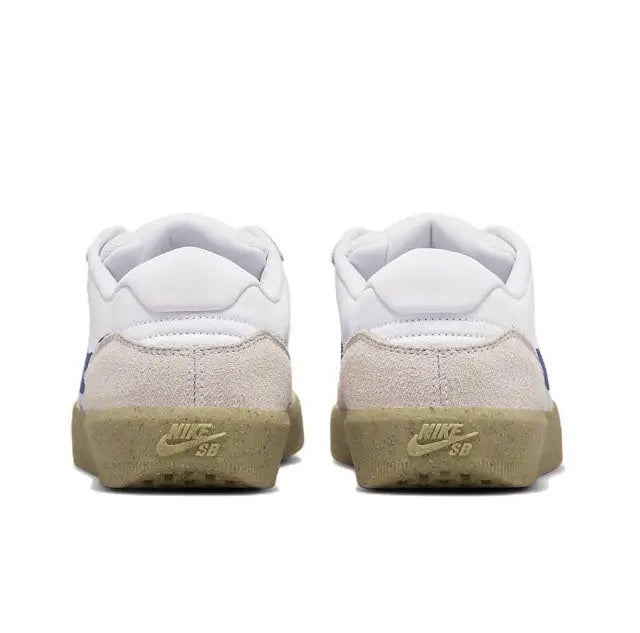 Low-top sneaker heel view with white upper, tan back panel, and gum outsole