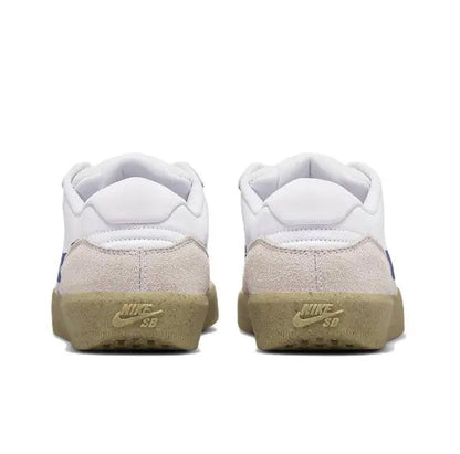 Low-top sneaker heel view with white upper, tan back panel, and gum outsole