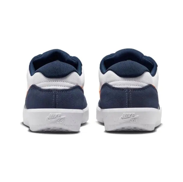 Navy heel and tongue with white trim on Nike SB low-top sneakers, white midsole