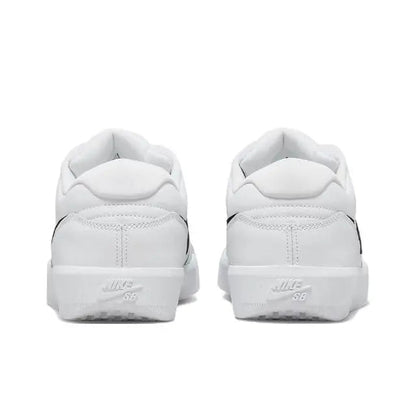White low-top skate sneaker heel view with lace-up collar and branding
