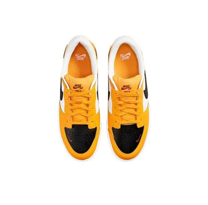 Front view of orange and black low-top sneakers with white toe cap and laces