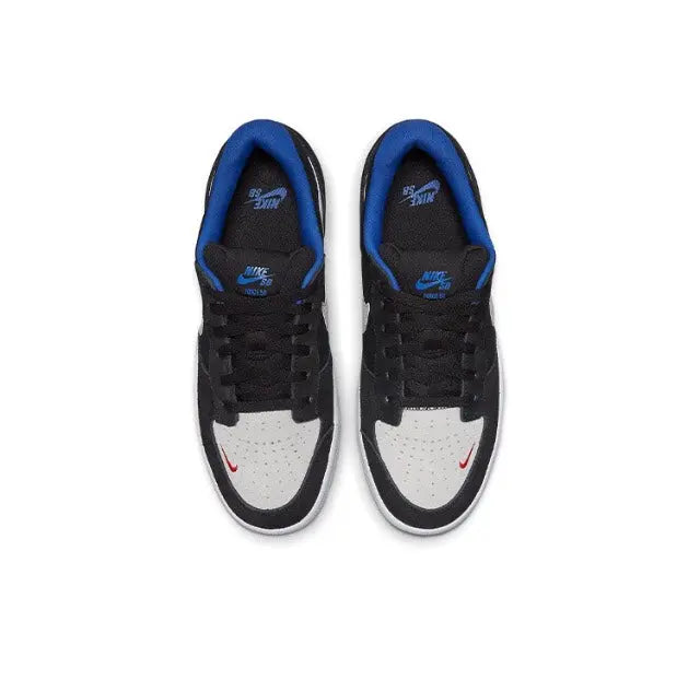 Black skate sneakers with white front panel, white Swoosh, and blue inner lining