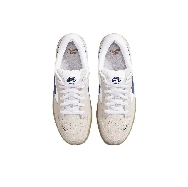 Low-top sneaker front view with white laces, perforated toe, and navy accents