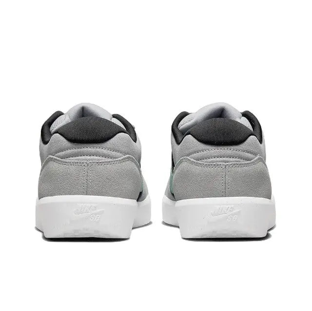 Nike SB Force 58 skate shoe heel view, grey upper with black collar and white sole