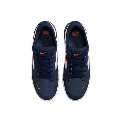 Pair of navy low-top sneakers with orange accent and black lace-up eyelets