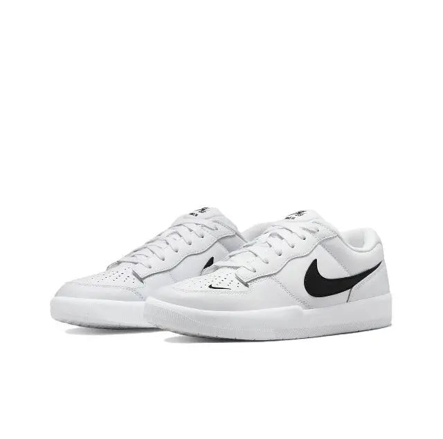 White low-top skate sneakers with black Nike Swoosh and textured toe box