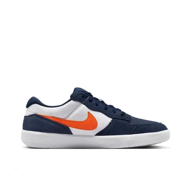 Navy and white low-top sneakers with orange swoosh and white rubber sole