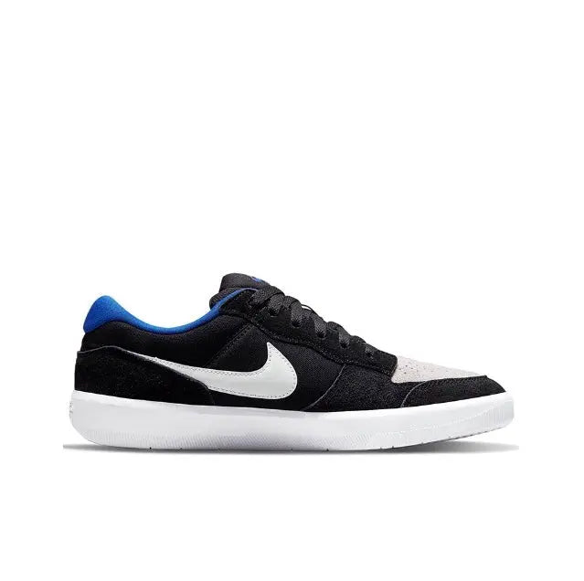 Black low-top skate sneaker with white Swoosh, blue collar, and white midsole