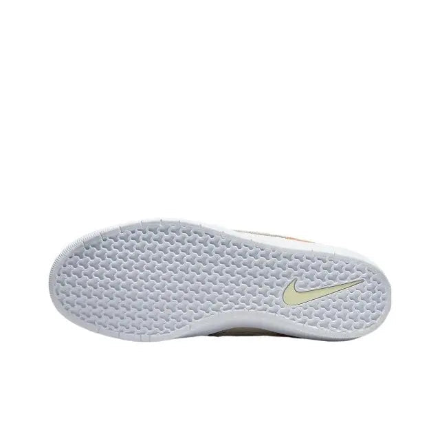 Textured outsole of Nike SB low-top sneaker with light mint Nike swoosh detail.