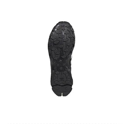 Shoe outsole with textured tread, dark black rubber