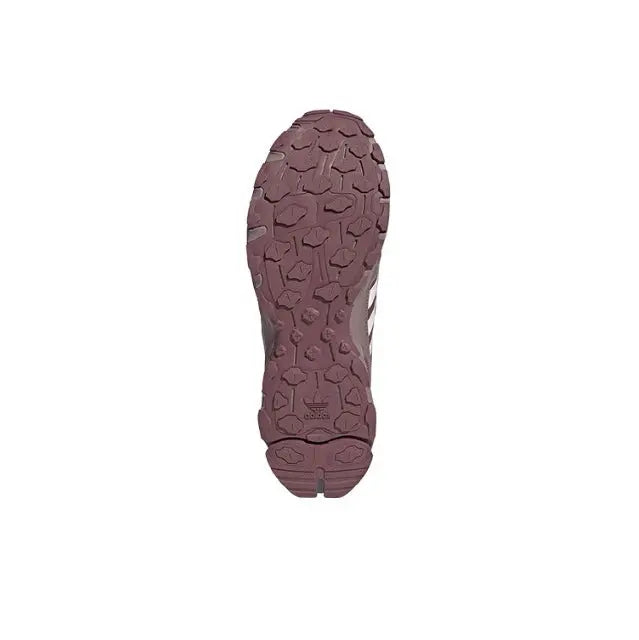 Adidas sneaker outsole with deep traction lugs in maroon rubber
