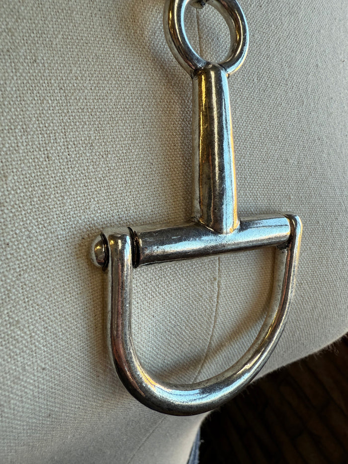 Silver snaffle bit pendant with small side detail on chain necklace