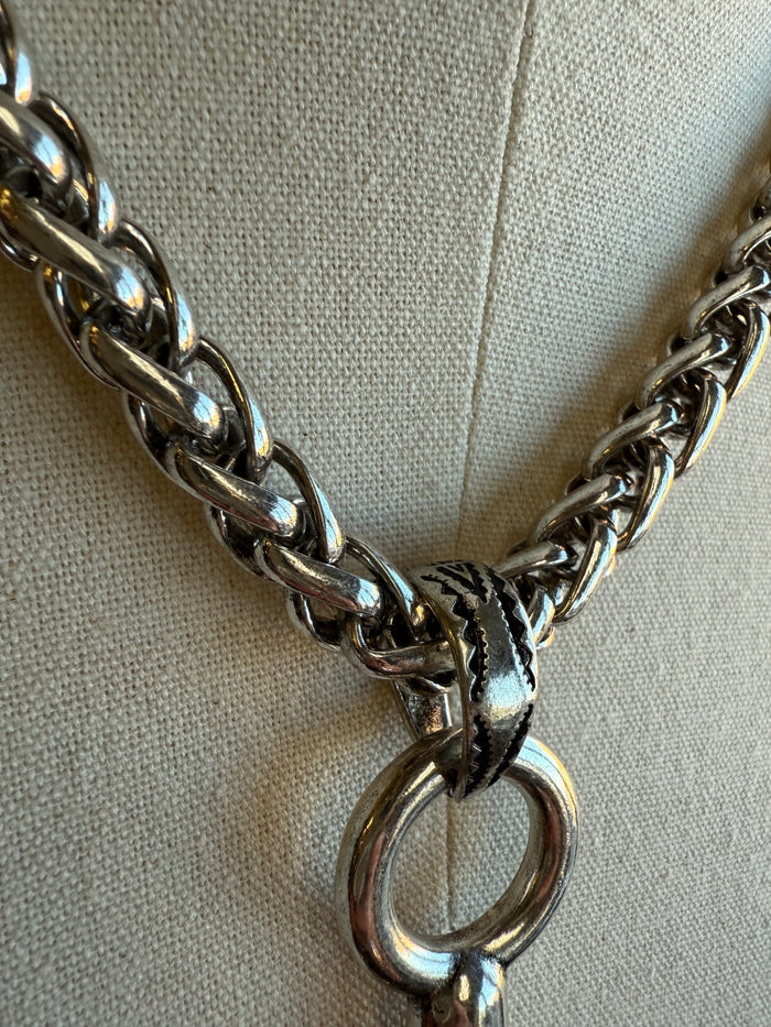 Silver braided chain necklace with snaffle bit ring and clasp