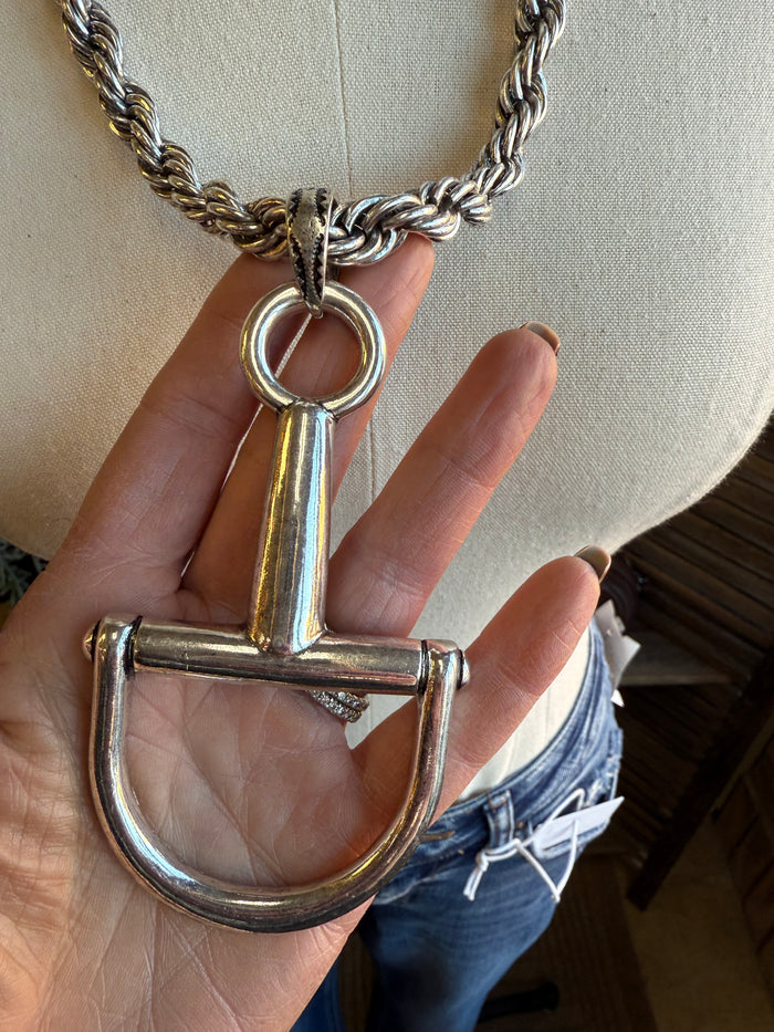 Silver braided chain necklace with snaffle bit pendant and large circular ring