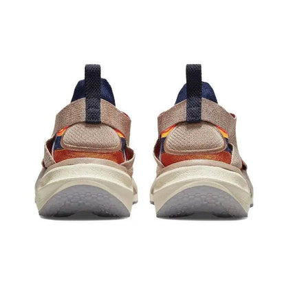 Back view of knit sneaker with navy heel strap and cream midsole