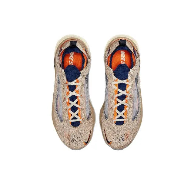 Lace-up knit sneaker front with orange and blue interior lining