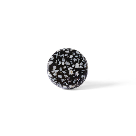 The Speckle Black and White Knob 4.4cm features a round shape with a terrazzo-inspired pattern, shown against a plain white background—an elegant accent for modern home decor.