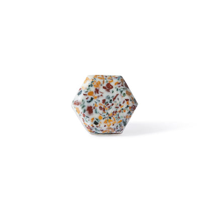 The Speckle Hexa Knob 4.6cm features a hexagonal terrazzo design with a white base and colorful speckles, shown upright on a plain white background—perfect as a decorative furniture knob.