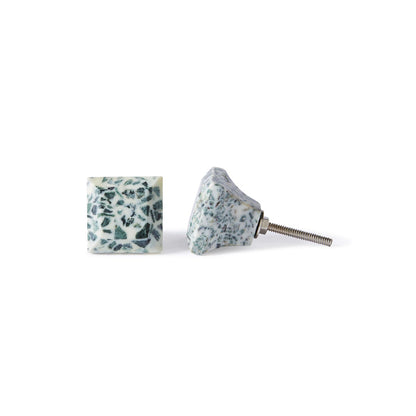 Two Speckle Square Knob 3.5cm, featuring a white base with a dark green speckled pattern, are shown from the front and side. One knob’s screw is visible, making installation easy and adding a stylish accent to your cabinet.