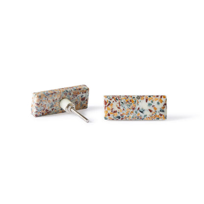 Two rectangular stud earrings with a vibrant Speckle Terazzo Knob Large 6.7cm pattern—one lies flat, the other reveals the metal post, echoing Early Settler’s distinctive decorative style.