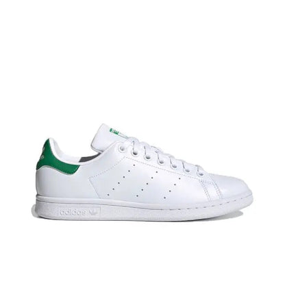 White leather sneakers with green heel detail and perforated toe