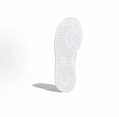 Adidas Stan Smith sneaker outsole, textured tread on white rubber sole