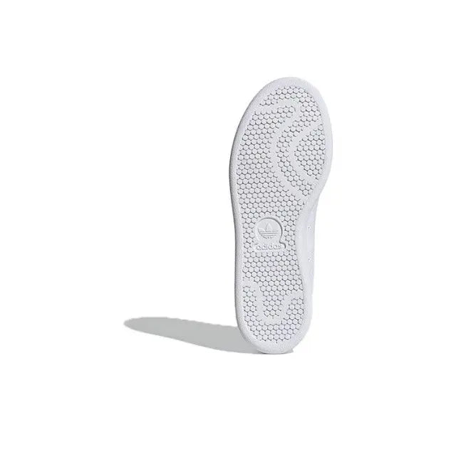 White rubber outsole with tread pattern and embossed logo