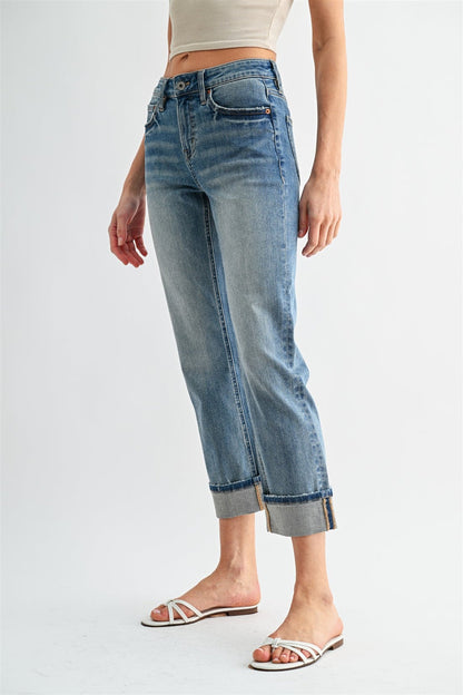Light blue straight-crop jeans with zip fly, back patch pockets, and cuffed hem