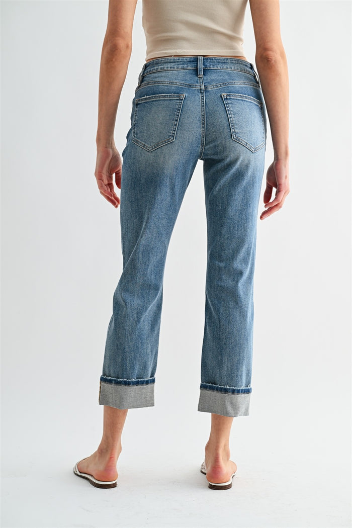 Light blue straight-crop cuffed jeans with front pockets and belt loops