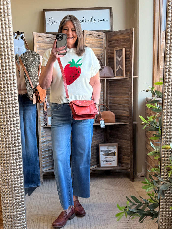 Cream short-sleeve sweater with strawberry and green leaf intarsia-style knit