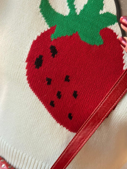 Cream short-sleeve sweater with red strawberry knit graphic and green leaves