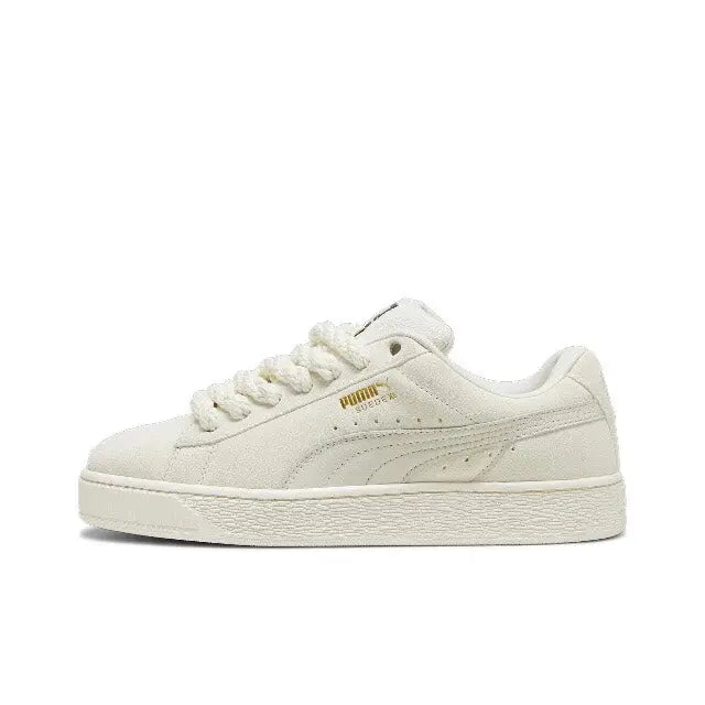 Puma suede sneaker in light beige with lace-up front, Puma stripe, and white sole